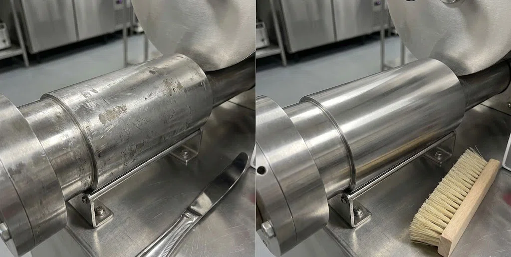 A side-by-side comparison showing the difference between a roller cleaned with a metal tool (scratched) vs. one cleaned with a specialized brush (smooth)