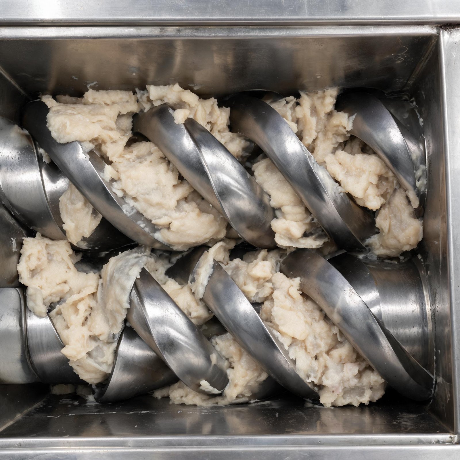 close-up-of-dough-mixing-stage-in-twin-screw-extruder